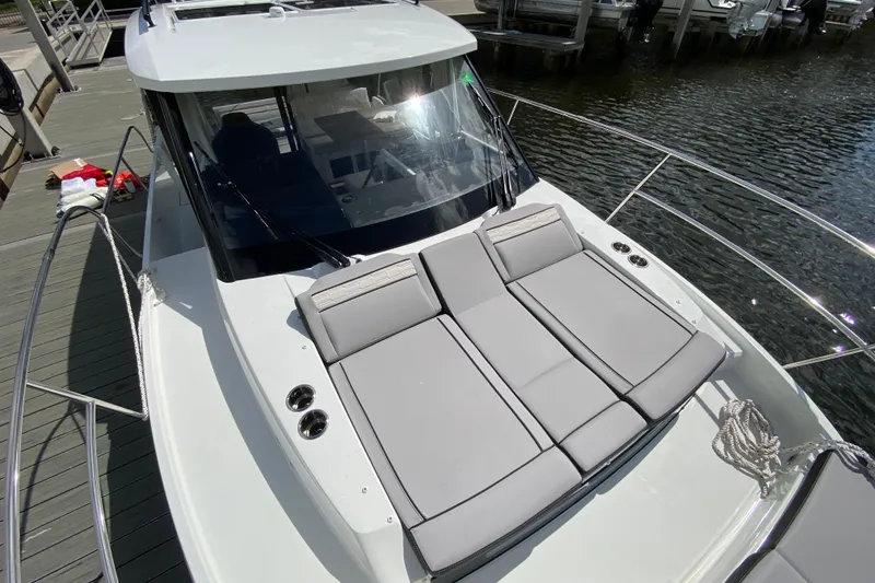 Slide: The Image of 2026 Jeanneau NC 895 Series 2 boat with sunbathing cushions on deck. - 61