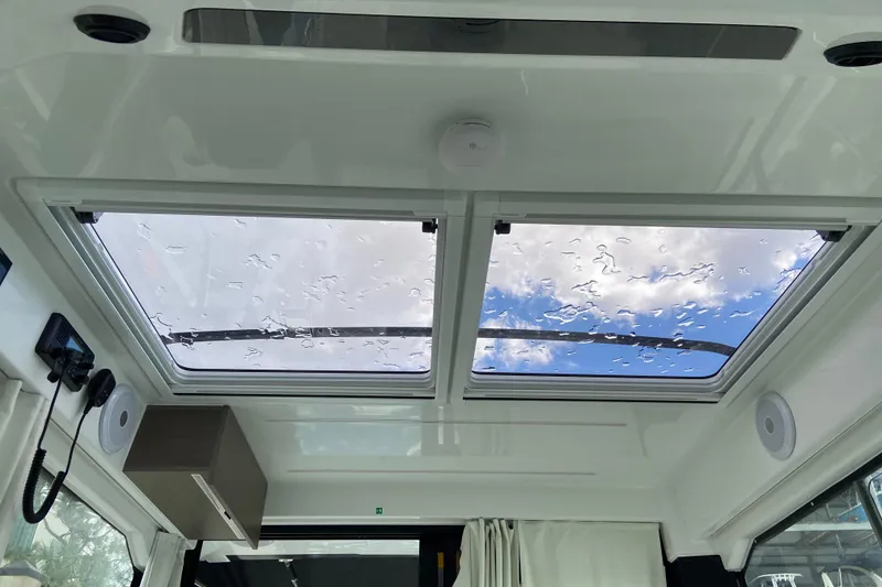 Slide: The Image of Interior view of 2026 Jeanneau NC 895 Series 2 boat with skylight and modern features. - 25