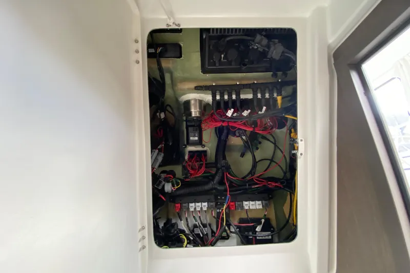 Slide: The Image of Electrical panel of 2026 Jeanneau NC 895 Series 2 boat, showcasing wiring and components. - 53