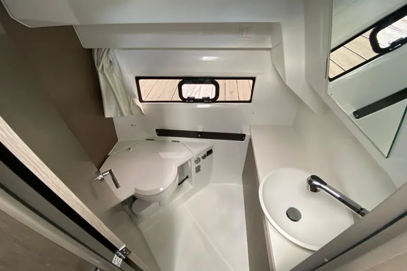 Slide: The Image of Modern bathroom interior of 2026 Jeanneau NC 895 Series 2 boat, featuring toilet and sink. - 49