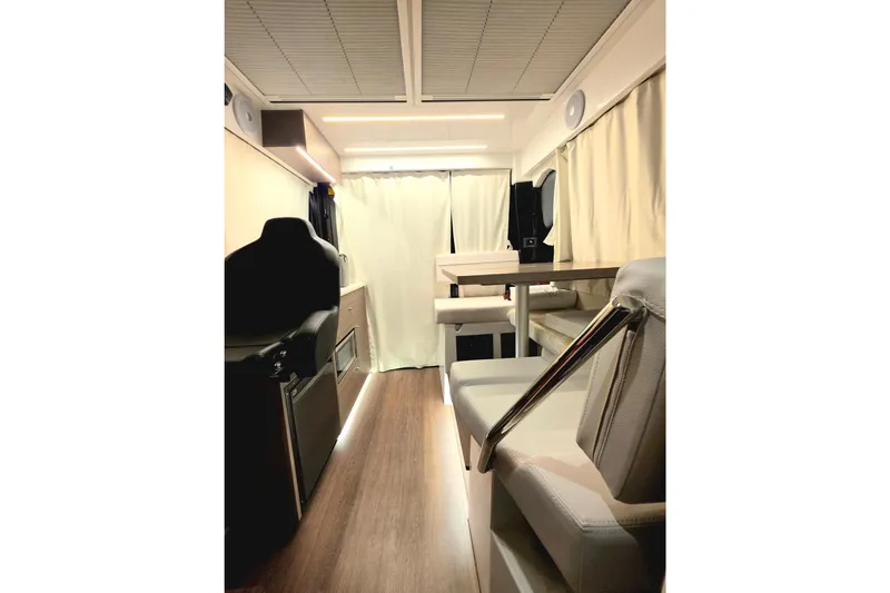 Slide: The Image of Interior of 2026 Jeanneau NC 895 Series 2 boat, featuring modern seating and wood flooring. - 7