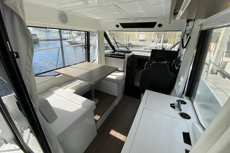 Slide: The Image of Interior of 2026 Jeanneau NC 895 Series 2 boat with seating and helm. - 14