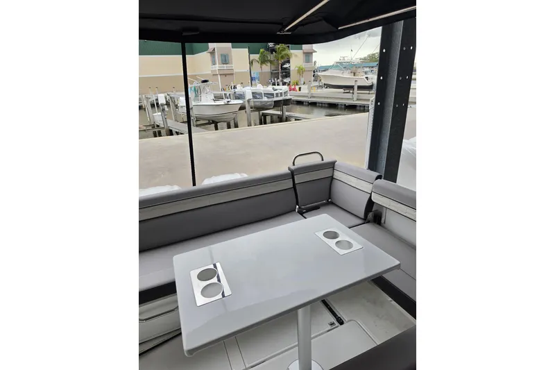 Slide: The Image of Interior of 2026 Jeanneau NC 895 Series 2 boat with sleek seating and table. - 8