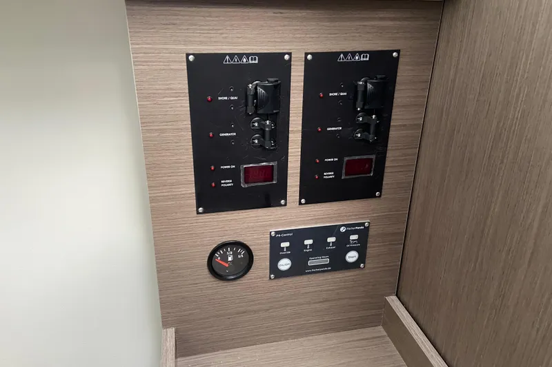 Slide: The Image of Control panel of 2026 Jeanneau NC 895 Series 2 boat, featuring switches and gauges. - 54