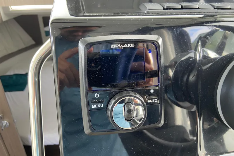 Slide: The Image of Control panel of a 2026 Jeanneau NC 895 Series 2 boat, featuring Zipwake system. - 22