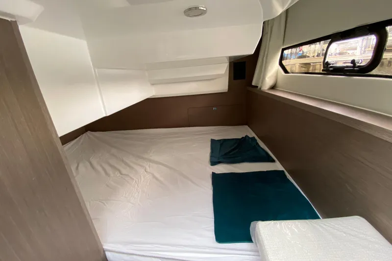 Slide: The Image of Interior cabin of 2026 Jeanneau NC 895 Series 2 with bed and window view. - 56
