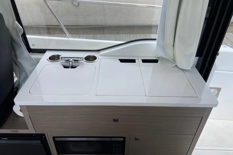 Slide: The Image of Compact kitchenette in 2026 Jeanneau NC 895 Series 2 boat, featuring sink and storage. - 28