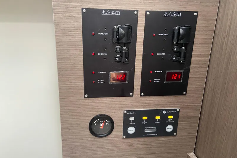 Slide: The Image of Control panel of 2026 Jeanneau NC 895 Series 2 boat with digital displays and switches. - 55
