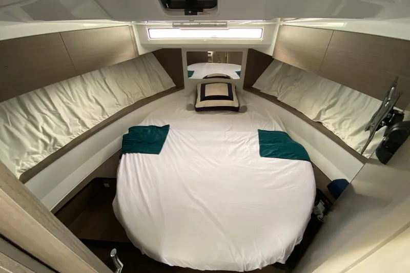 Slide: The Image of Luxurious cabin interior of 2026 Jeanneau NC 895 Series 2 with cozy bedding. - 41