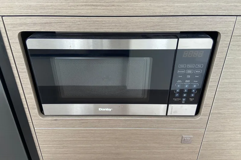 Slide: The Image of Built-in Danby microwave in Jeanneau NC 895 Series 2, 2026 model. - 33