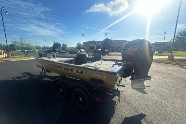 Slide: The Image of 2026 Tracker Pro Team 195 boat on trailer under bright sunlit sky. - 3