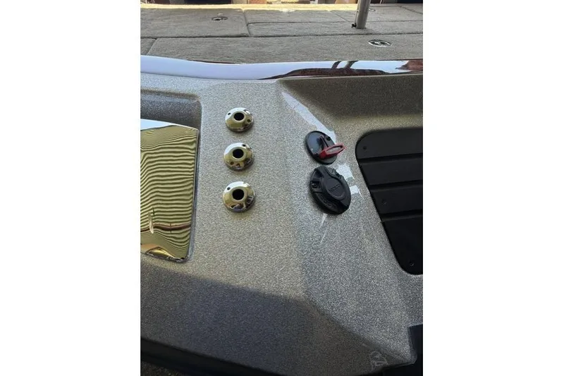 Slide: The Image of Control panel of 2026 Ranger Z521R Cup-Equipped boat with metallic finish and switches. - 14