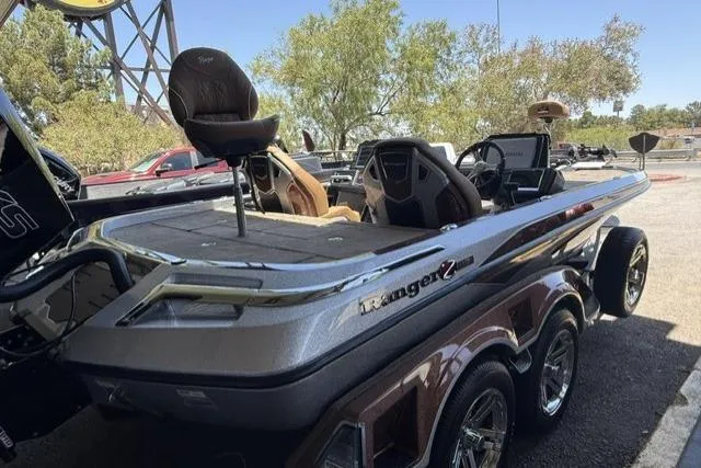 Slide: The Image of 2026 Ranger Z521R Cup-Equipped boat with sleek design and dual seats, parked outdoors. - 2