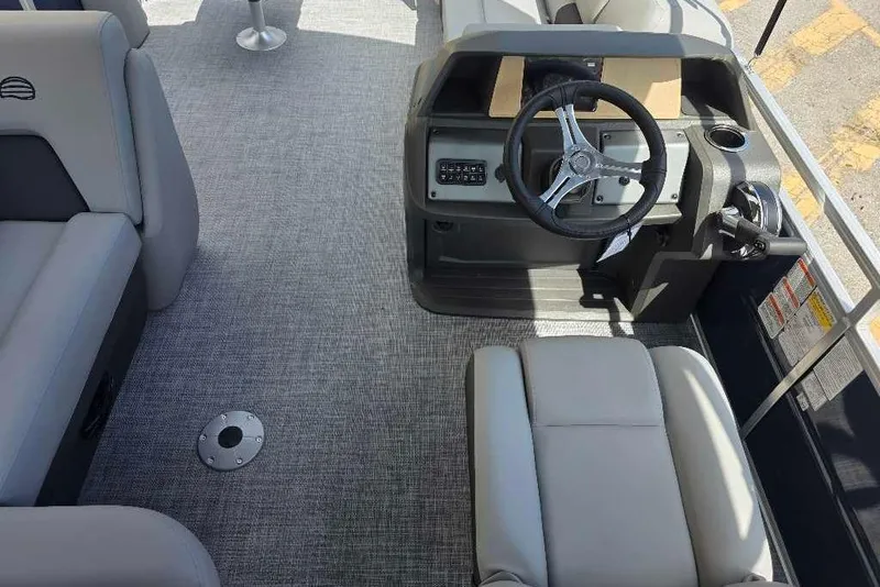 Slide: The Image of Interior view of 2026 Sun Tracker SportFish 20 DLX pontoon boat with steering console. - 7