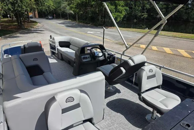 Slide: The Image of 2026 Sun Tracker SportFish 20 DLX pontoon boat with spacious seating and modern design. - 8