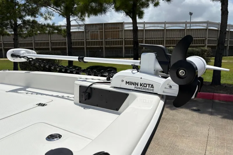 Slide: The Image of 2026 Mako Pro Skiff 17 CC with Minn Kota PowerDrive trolling motor on deck. - 4
