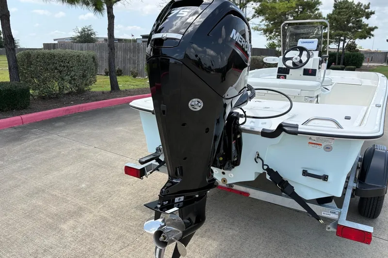 Slide: The Image of 2026 Mako Pro Skiff 17 CC boat with Mercury outboard motor on trailer. - 8