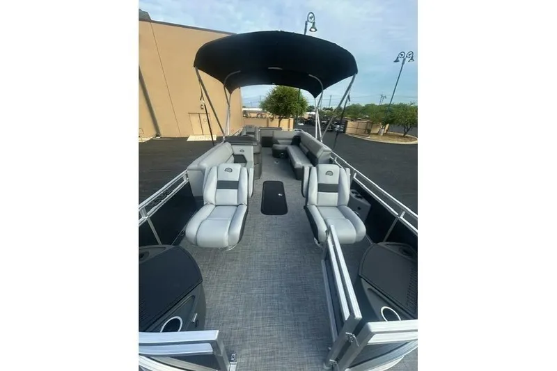 Slide: The Image of 2026 Sun Tracker Sportfish 24 XP3 pontoon boat with spacious seating and canopy. - 4