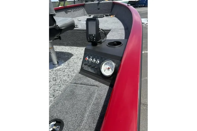 Slide: The Image of 2026 Tracker Super Guide V-16 T boat dashboard with controls and fish finder. - 9