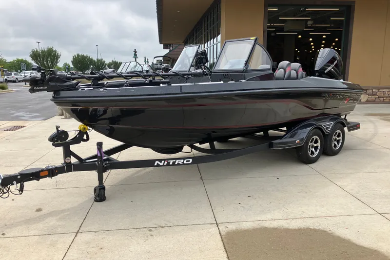 Slide: The Image of 2026 Nitro ZV20 Pro boat on trailer, parked outside a building. - 1