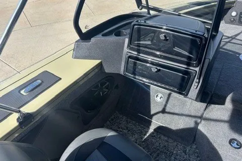 Slide: The Image of 2026 Tracker Targa V-19 WT boat interior with storage compartments and seating. - 14
