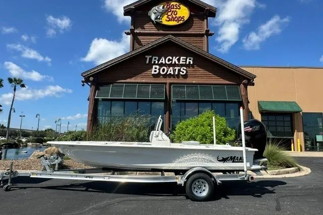 The Image of 2026 Mako 18 Pro Skiff boat on trailer outside Bass Pro Shops Tracker Boats. - 0