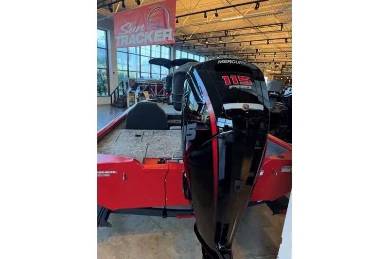 Slide: The Image of 2026 Tracker Pro Team 190 boat with Mercury 115 engine in showroom. - 4