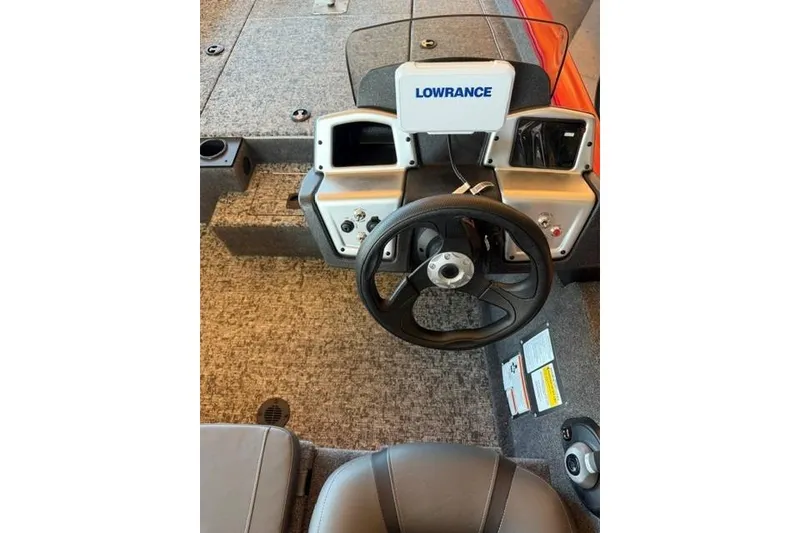 Slide: The Image of 2026 Tracker Pro Team 190 boat dashboard with Lowrance electronics and steering wheel. - 7