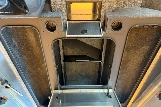 Slide: The Image of Interior view of 2026 Tracker Pro Team 190 boat storage compartments. - 9