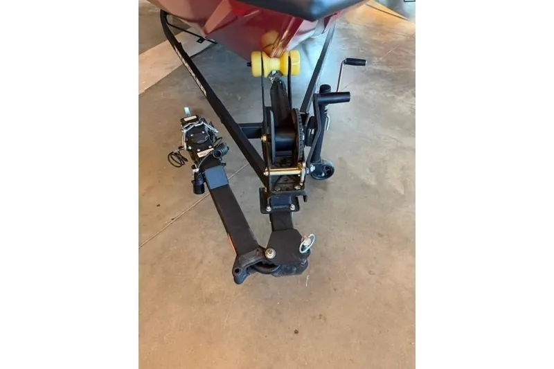 Slide: The Image of Trailer hitch of 2026 Tracker Pro Team 190 boat on concrete floor. - 14