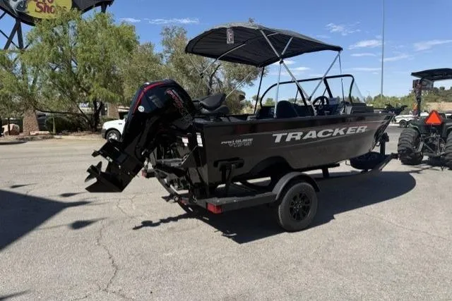 Slide: The Image of 2026 Tracker Pro Guide V-175 Combo boat on trailer, parked outdoors. - 3