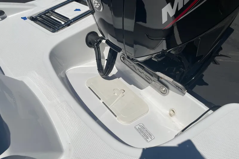 Slide: The Image of 2026 Tahoe T16 boat engine compartment with Mercury motor, showcasing sleek design and functionality. - 22