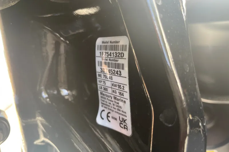 Slide: The Image of Close-up of a Mercury Marine engine label on a 2026 Tahoe T16 boat. - 82
