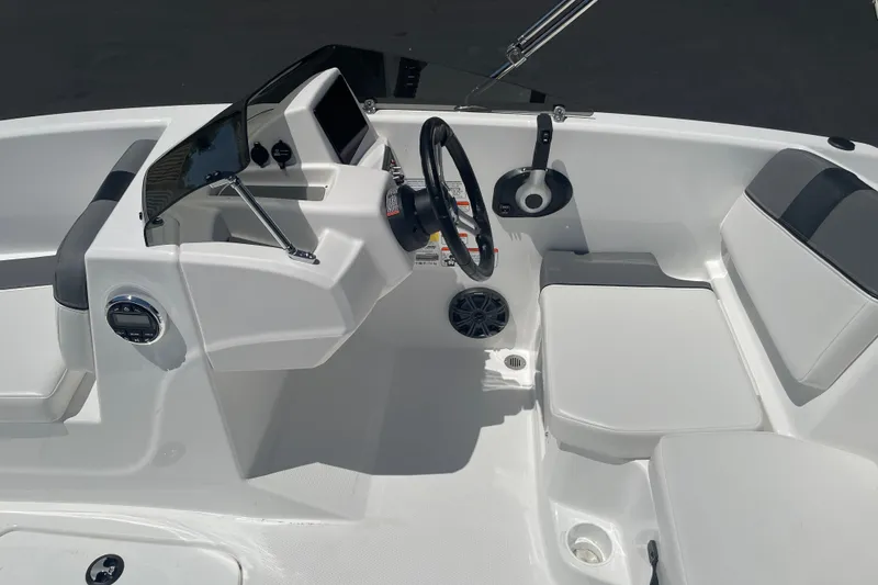 Slide: The Image of 2026 Tahoe T16 boat interior with steering wheel, seating, and control panel. - 17