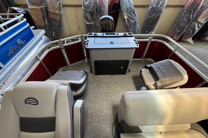Slide: The Image of 2026 Sun Tracker SportFish 20 DLX interior with seating and control panel. - 3