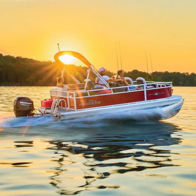 The Image of 2026 Sun Tracker Bass Buggy 16 XL Select on a calm lake at sunset. - 0