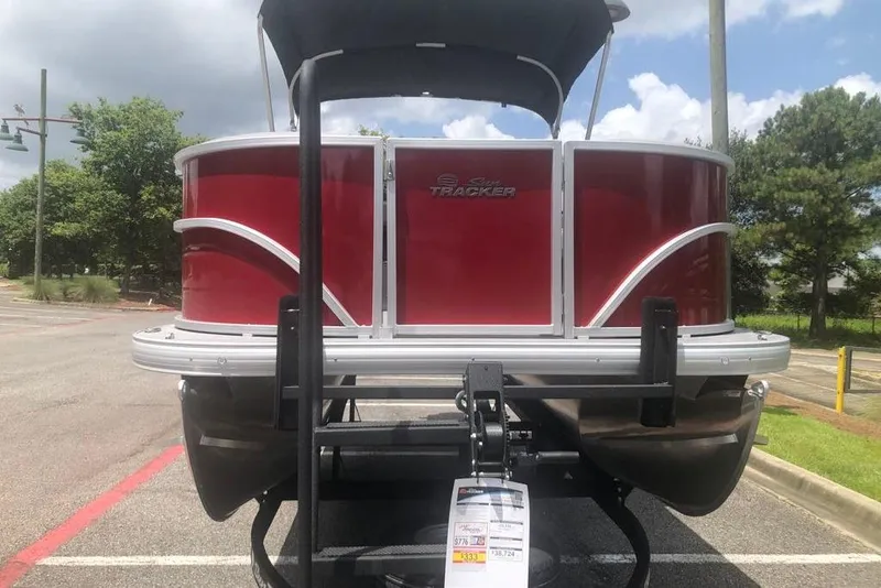 Slide: The Image of 2026 Sun Tracker Party Barge 18 DLX pontoon boat in a parking lot. - 4