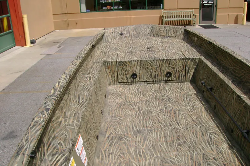 Slide: The Image of 2026 Tracker Grizzly 1650 T Prairie Wings Edition boat with camouflage design. - 5