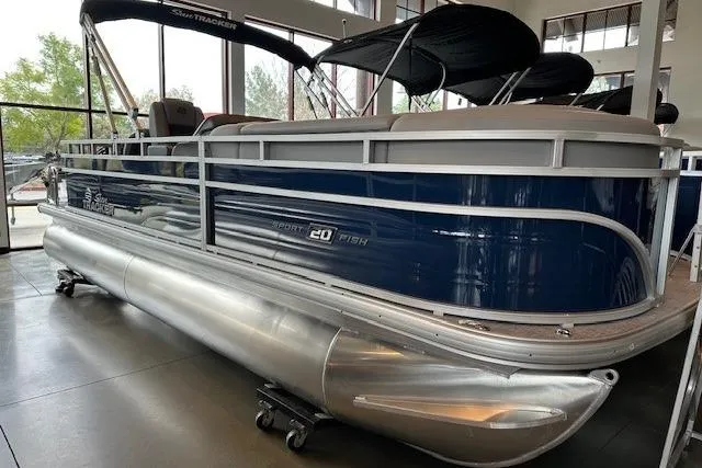 The Image of 2026 Sun Tracker SportFish 20 DLX pontoon boat displayed indoors. - 0