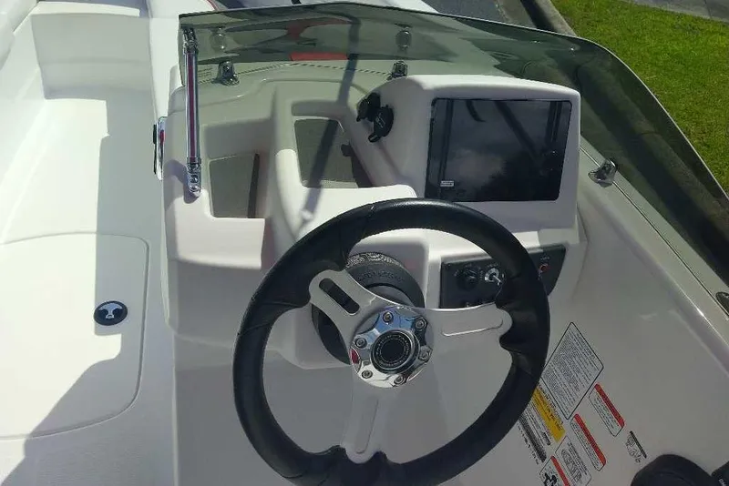 Slide: The Image of Steering console of a 2026 Tahoe T16 boat with modern controls and display. - 5