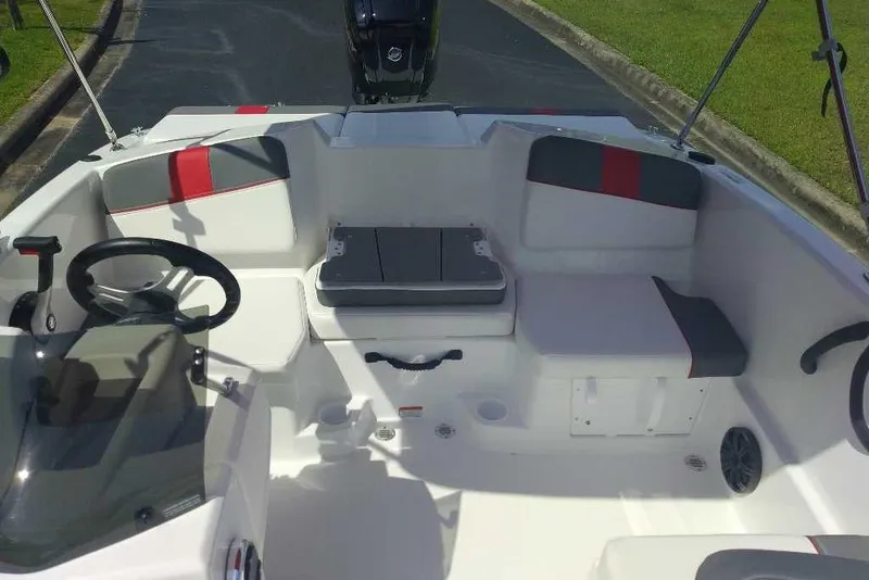 Slide: The Image of Interior of 2026 Tahoe T16 boat with modern seating and steering wheel. - 6