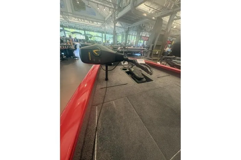 Slide: The Image of 2026 Tracker Pro Team 190 boat interior with trolling motor in showroom. - 6