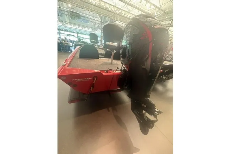 Slide: The Image of 2026 Tracker Pro Team 190 boat with outboard motor in showroom. - 4