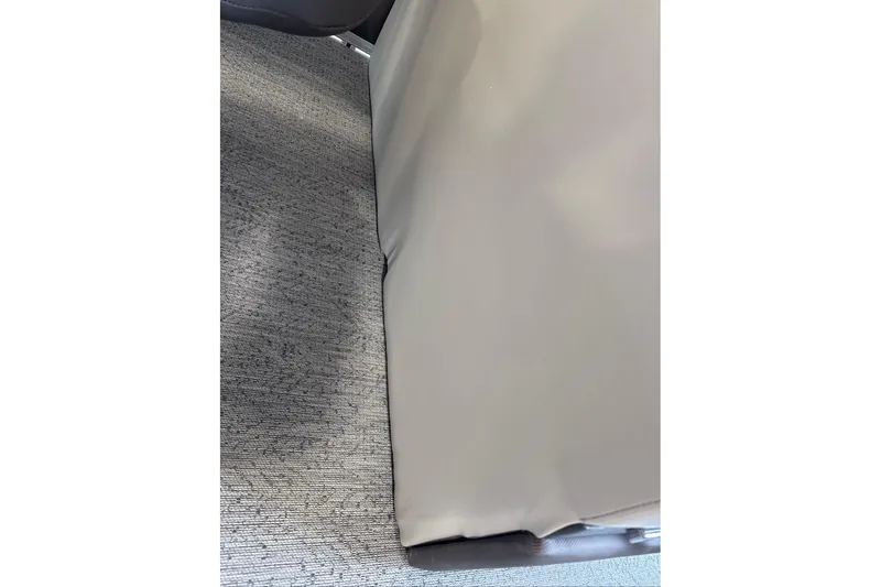 Slide: The Image of Close-up of 2026 Sun Tracker Fishin' Barge 20 DLX seat and carpet detail. - 12