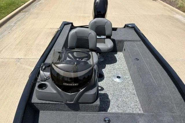 Slide: The Image of 2026 Tracker Super Guide V-16 SC boat interior with dual seats and steering console. - 48