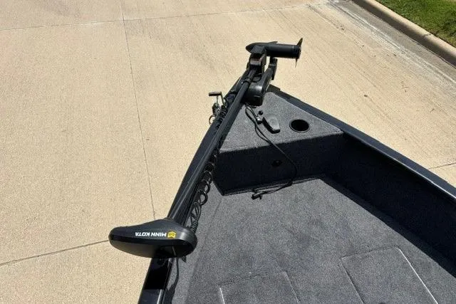 Slide: The Image of 2026 Tracker Super Guide V-16 SC boat with Minn Kota trolling motor on deck. - 52