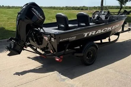 Slide: The Image of 2026 Tracker Super Guide V-16 SC boat with Mercury engine on a trailer. - 44