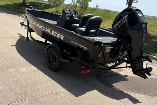 Slide: The Image of 2026 Tracker Super Guide V-16 SC boat with Mercury engine on trailer. - 46