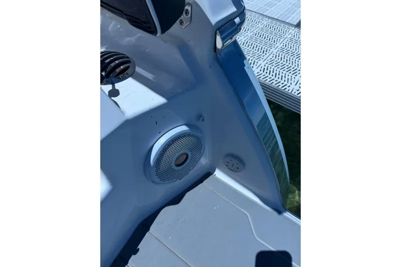 Slide: The Image of 2022 Regal 22 FasDeck boat interior with speaker and control panel detail. - 11