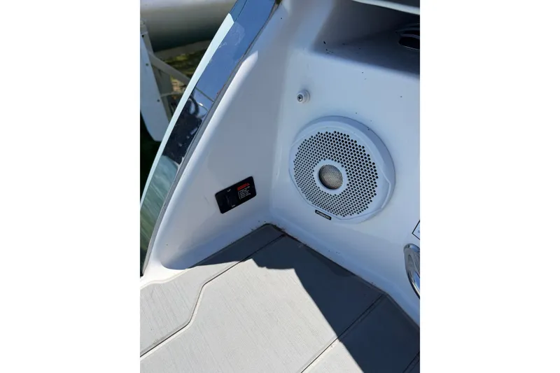 Slide: The Image of 2022 Regal 22 FasDeck boat interior with speaker and control panel. - 10